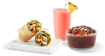 A display of Tropical Smoothie Cafe menu items including a Baja Chicken wrap, a Sunrise Sunset smoothie, and an Acai bowl with Nutella, promoting fresh tropical flavors